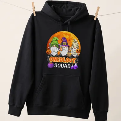 Cartoonish Halloween gnomes with the phrase Oncology Squad in vibrant colors — printed on a unisex hoodie