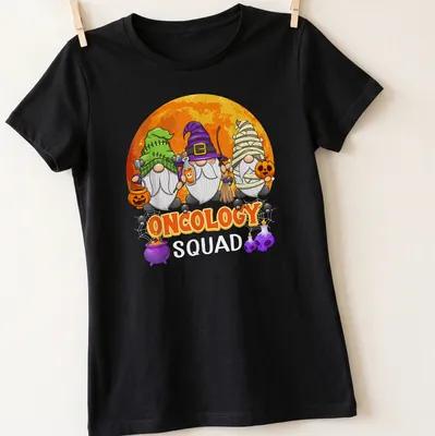 Cartoonish Halloween gnomes with the phrase Oncology Squad in vibrant colors — printed on a women's shirt