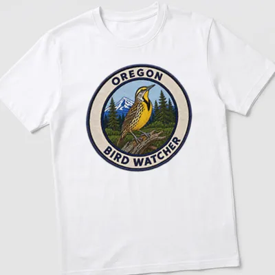 Vintage patch style t-shirt featuring a Western Meadowlark and text about bird watching