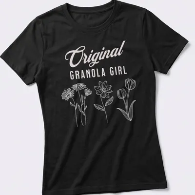 Minimalist line-art floral design with 'Original Granola Girl' text in pink — printed on a women's shirt