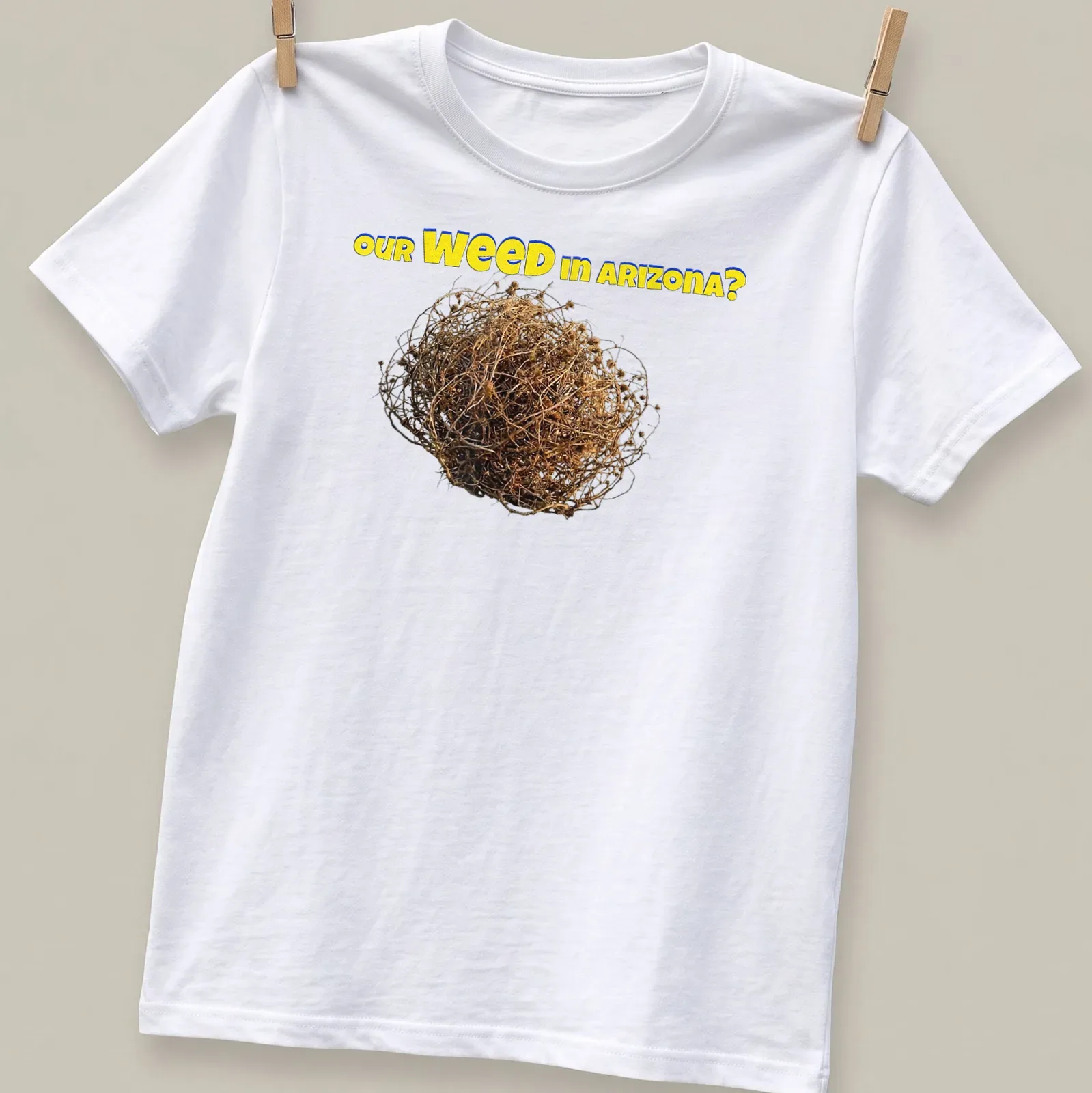 Bold colorful T-shirt with tumbleweed and the text 'our WEED in ARIZONA?' — printed on a unisex t-shirt