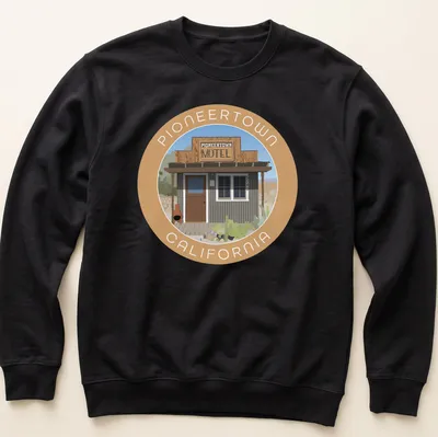 Vintage-style Pioneertown Motel graphic tee featuring earthy tones and nostalgic font — printed on a unisex sweatshirt
