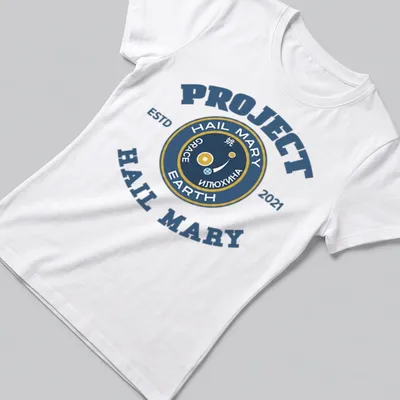 Vintage style t-shirt with a space mission emblem in navy, gold, and white. — printed on a women's shirt