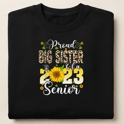 Colorful design featuring a proud big sister message with sunflower and graduation cap — printed on a unisex sweatshirt
