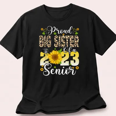 Colorful design featuring a proud big sister message with sunflower and graduation cap — printed on a unisex t-shirt