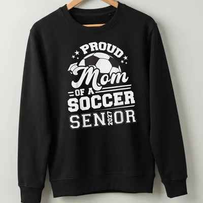 Bold typography celebrating Proud Mom of a Soccer Senior 2027 with a soccer ball — printed on a unisex sweatshirt