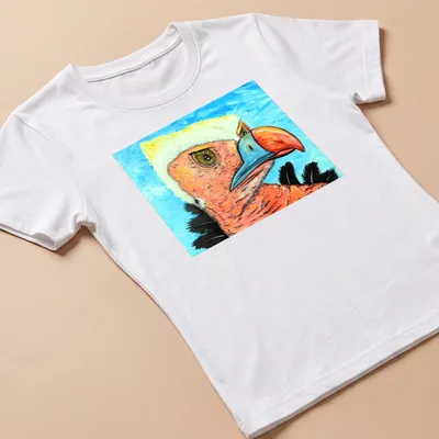 Realistic portrait of a quizzical vulture against a blue sky background — printed on a women's shirt