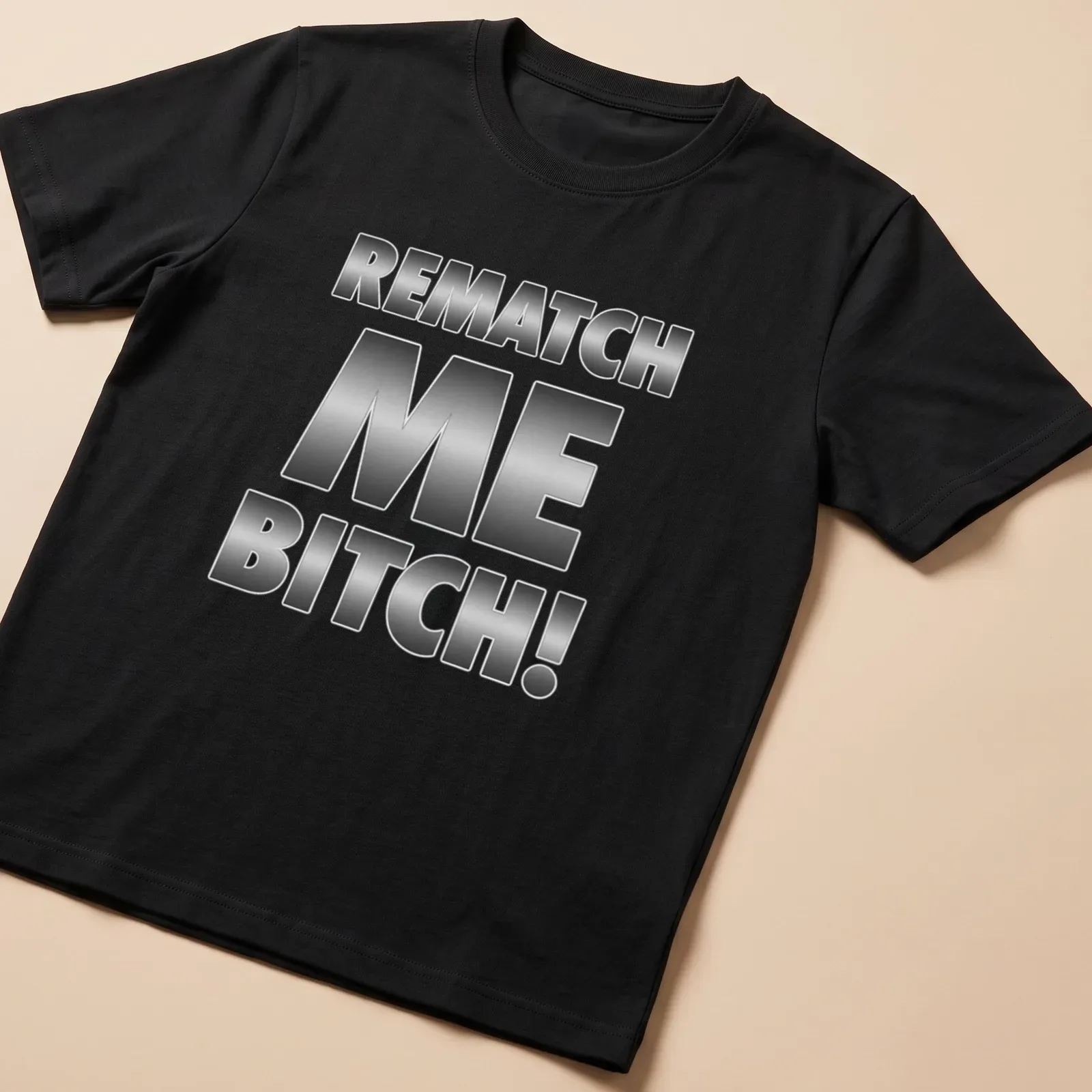 Bold metallic lettering says REMATCH ME BITCH! on a humorous — printed on a unisex t-shirt