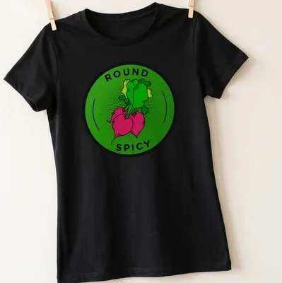 Colorful illustration of a radish with 'ROUND SPICY' text above it — printed on a women's shirt