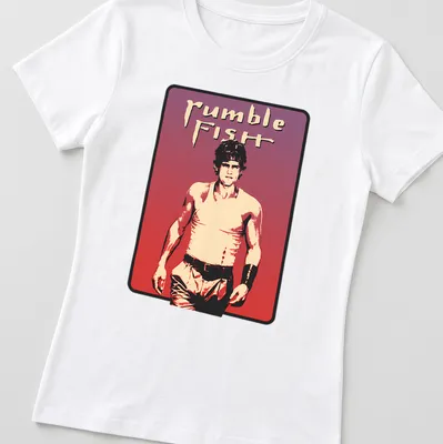 Vintage aesthetic t-shirt featuring Rumble Fish character and text in bold font — printed on a women's shirt
