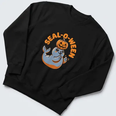 Cartoon seal with pumpkin and text SEAL-O-WEEN in orange, blue, and white — printed on a unisex sweatshirt