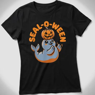 Cartoon seal with pumpkin and text SEAL-O-WEEN in orange, blue, and white — printed on a women's shirt