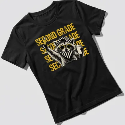 Bold cartoon of a raccoon holding a pencil and coffee with text saying 'SECOND GRADE' — printed on a women's shirt