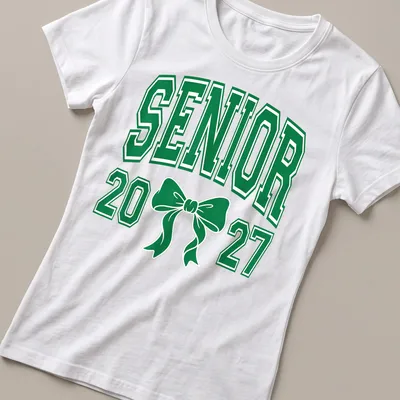 Green Senior 20 27 t-shirt featuring a Coquette bow and collegiate style — printed on a women's shirt