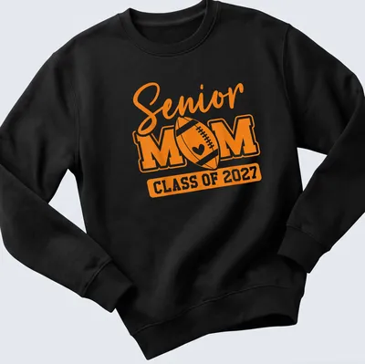 Bold typography Senior Mom Class Of 2027 T-shirt with football theme — printed on a unisex sweatshirt