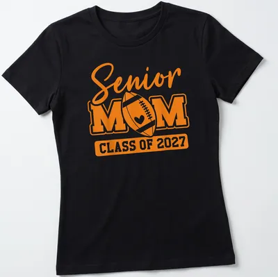 Bold typography Senior Mom Class Of 2027 T-shirt with football theme — printed on a women's shirt