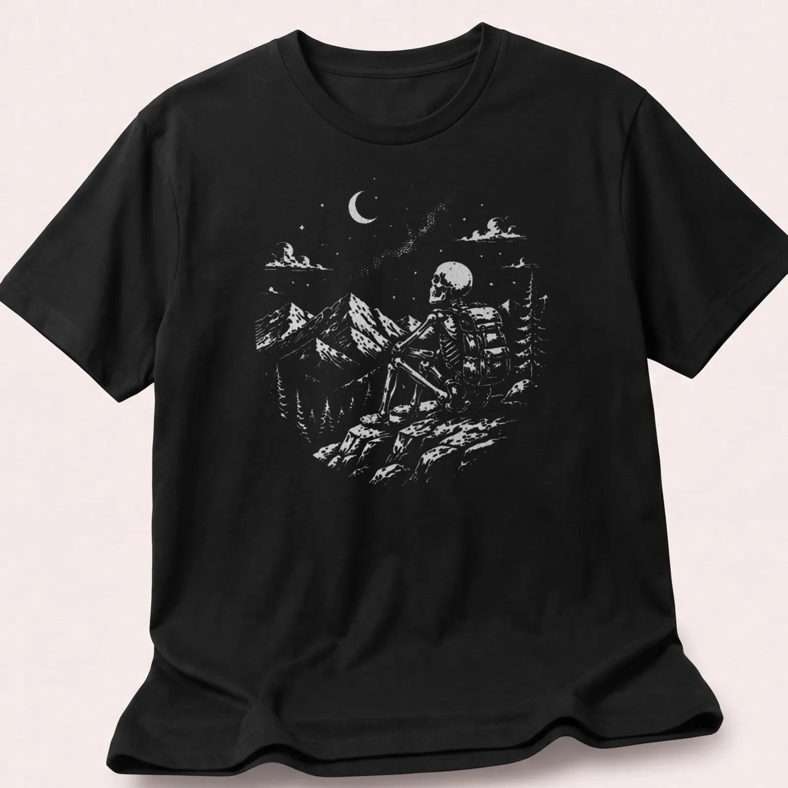 Vintage illustration of a skeleton hiker enjoying a mountain view in shades of gray and green. — printed on a unisex t-shirt