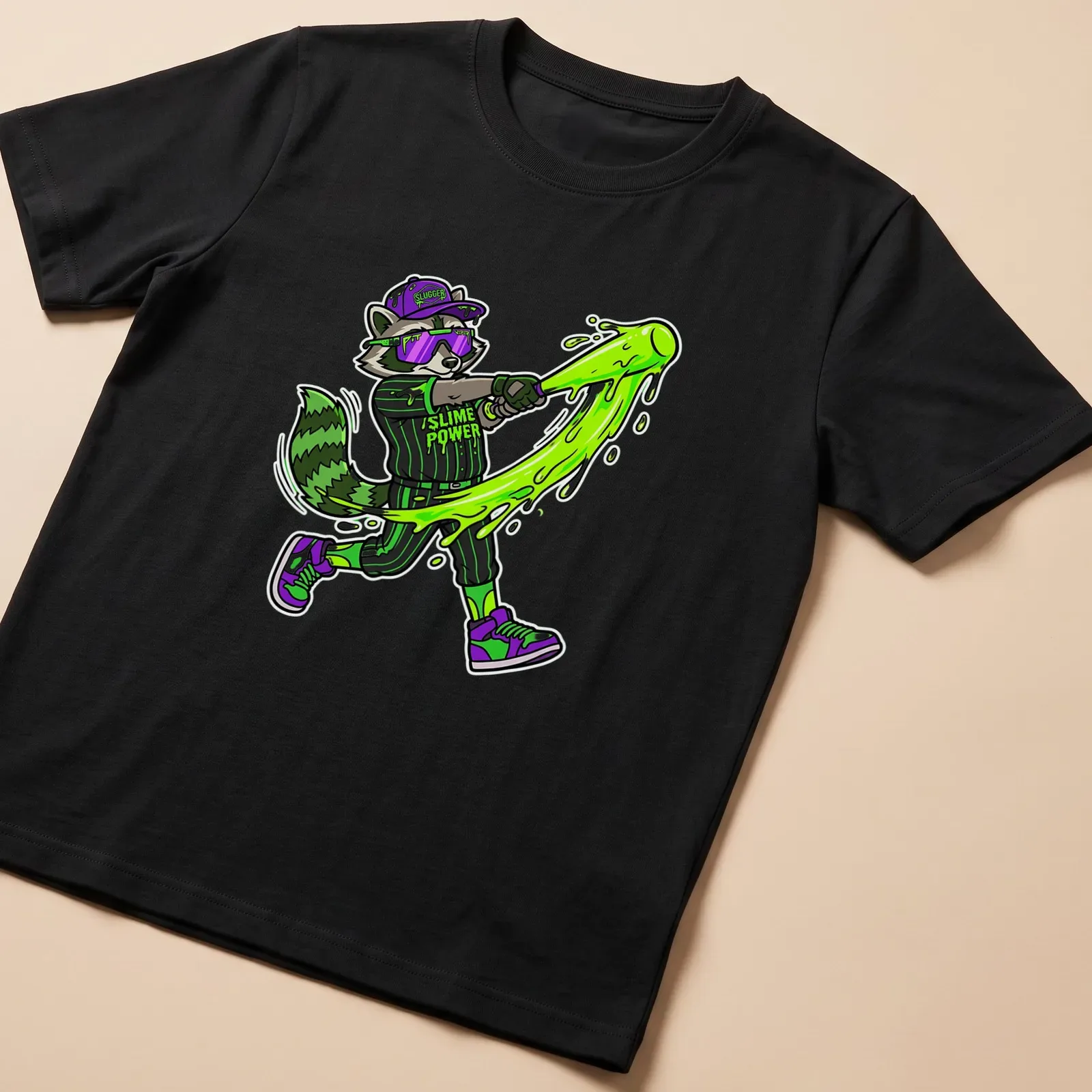 Cartoon raccoon swinging a bat with 'Slime Power' text in vibrant colors — printed on a unisex t-shirt