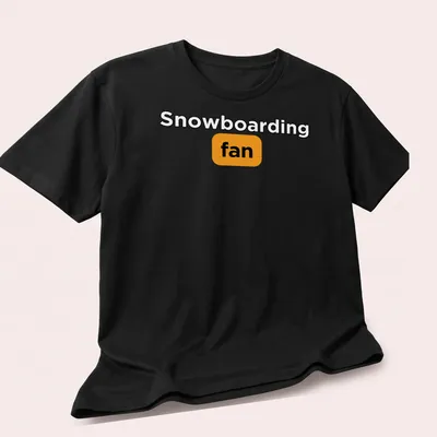 Bold typography Snowboarding Fan t-shirt in black, orange, and white — printed on a unisex t-shirt (angled view)