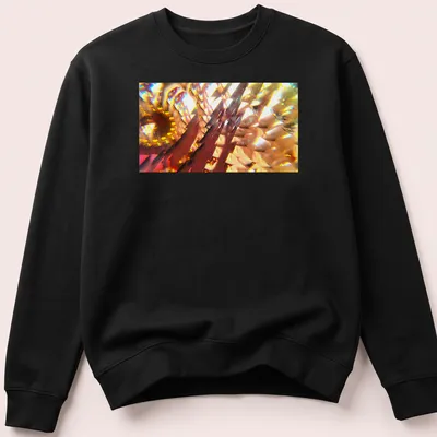 Vibrant digital art of an abstract floral design in yellow, orange, red, gold, and brown. — printed on a unisex sweatshirt