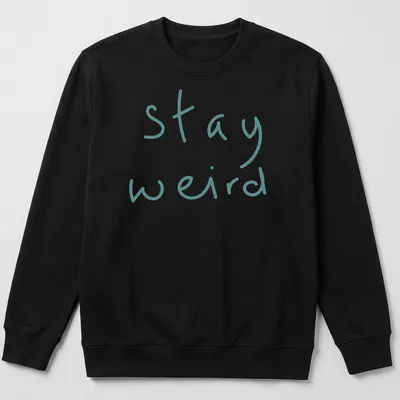 Playful handwritten text 'stay weird' in teal on a t-shirt. — printed on a unisex sweatshirt