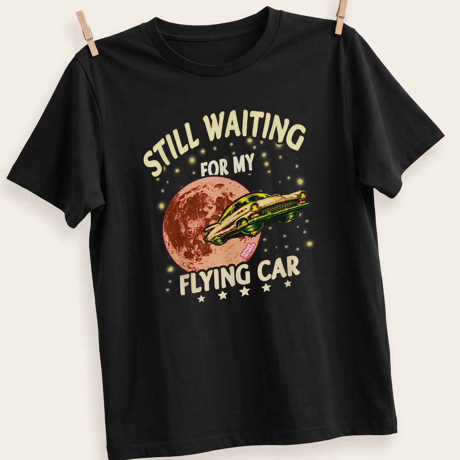 Retro t-shirt featuring a whimsical flying car with colorful text about waiting for it. — printed on a unisex t-shirt
