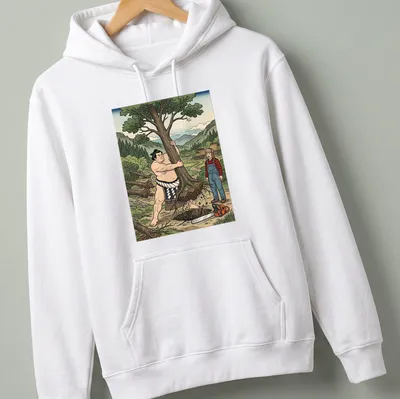 Cartoon of a sumo wrestler uprooting a tree with colorful accents — printed on a unisex hoodie