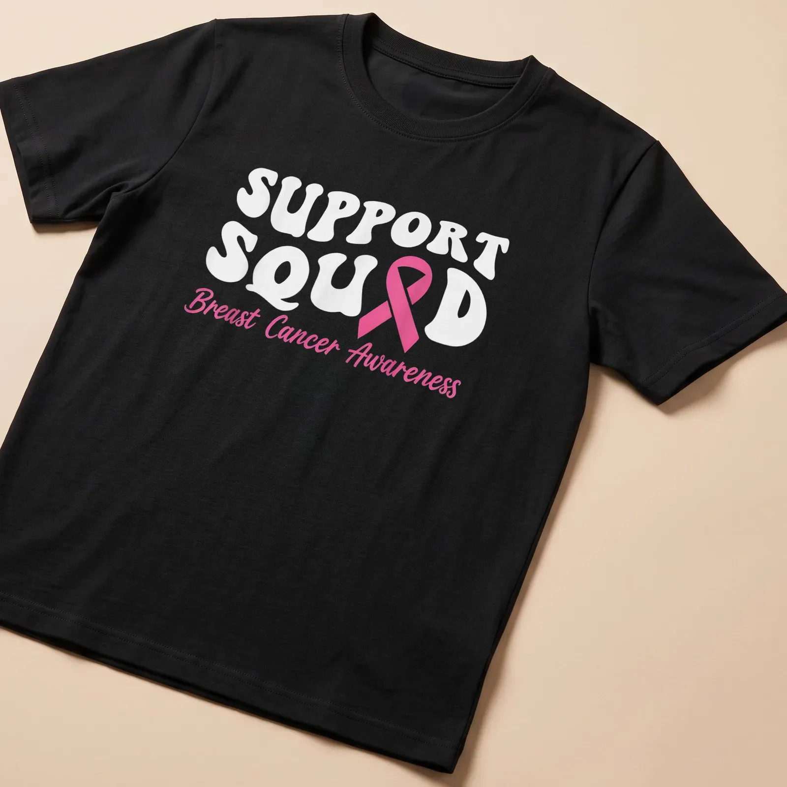Bold typography Support Squad Breast Cancer Awareness shirt with pink ribbon — printed on a unisex t-shirt