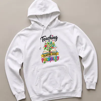 Colorful cartoon shirt with a plant growing from an open book and inspirational text. — printed on a unisex hoodie