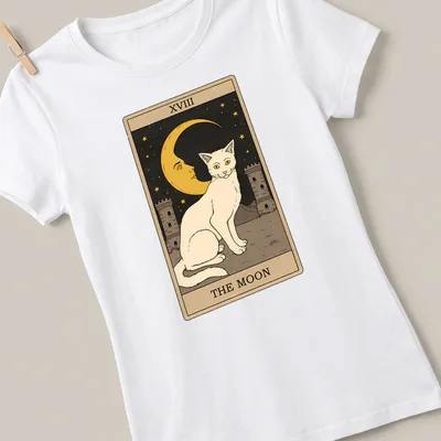 Vintage tarot design featuring a white cat with the text XVIII THE MOON — printed on a women's shirt