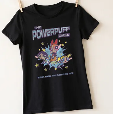 Colorful cartoon design featuring the Powerpuff Girls and the phrase about their qualities. — printed on a women's shirt