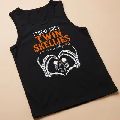 Playful Halloween shirt with twin skeletons and fun text in orange and white — printed on a tank top