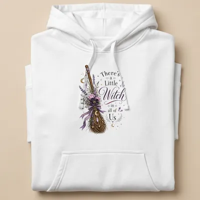 Vintage floral design with a witch broom and the phrase 'There's a Little Witch in all of Us' — printed on a unisex hoodie