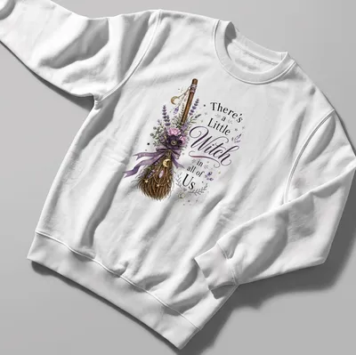 Vintage floral design with a witch broom and the phrase 'There's a Little Witch in all of Us' — printed on a unisex sweatshirt
