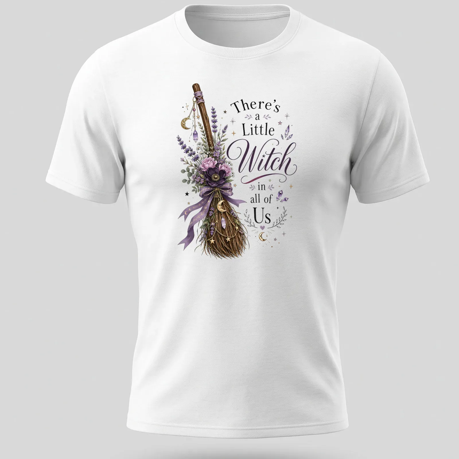 Vintage floral design with a witch broom and the phrase 'There's a Little Witch in all of Us' — printed on a unisex t-shirt