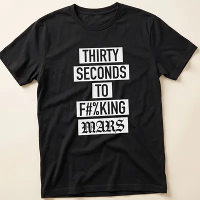 Bold typography T-shirt with band slogan in white on a dark background