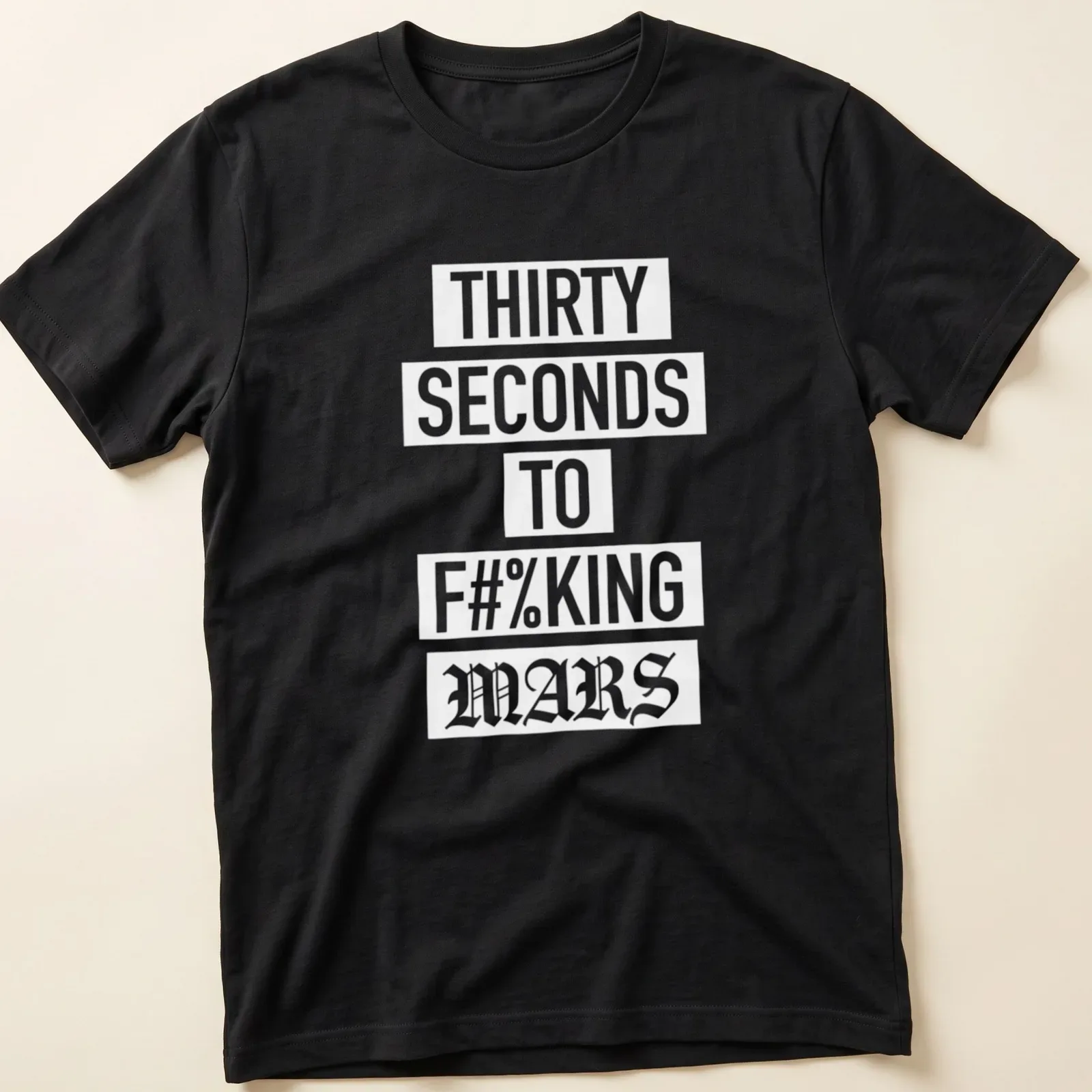 Bold typography T-shirt with band slogan in white on a dark background — printed on a unisex t-shirt