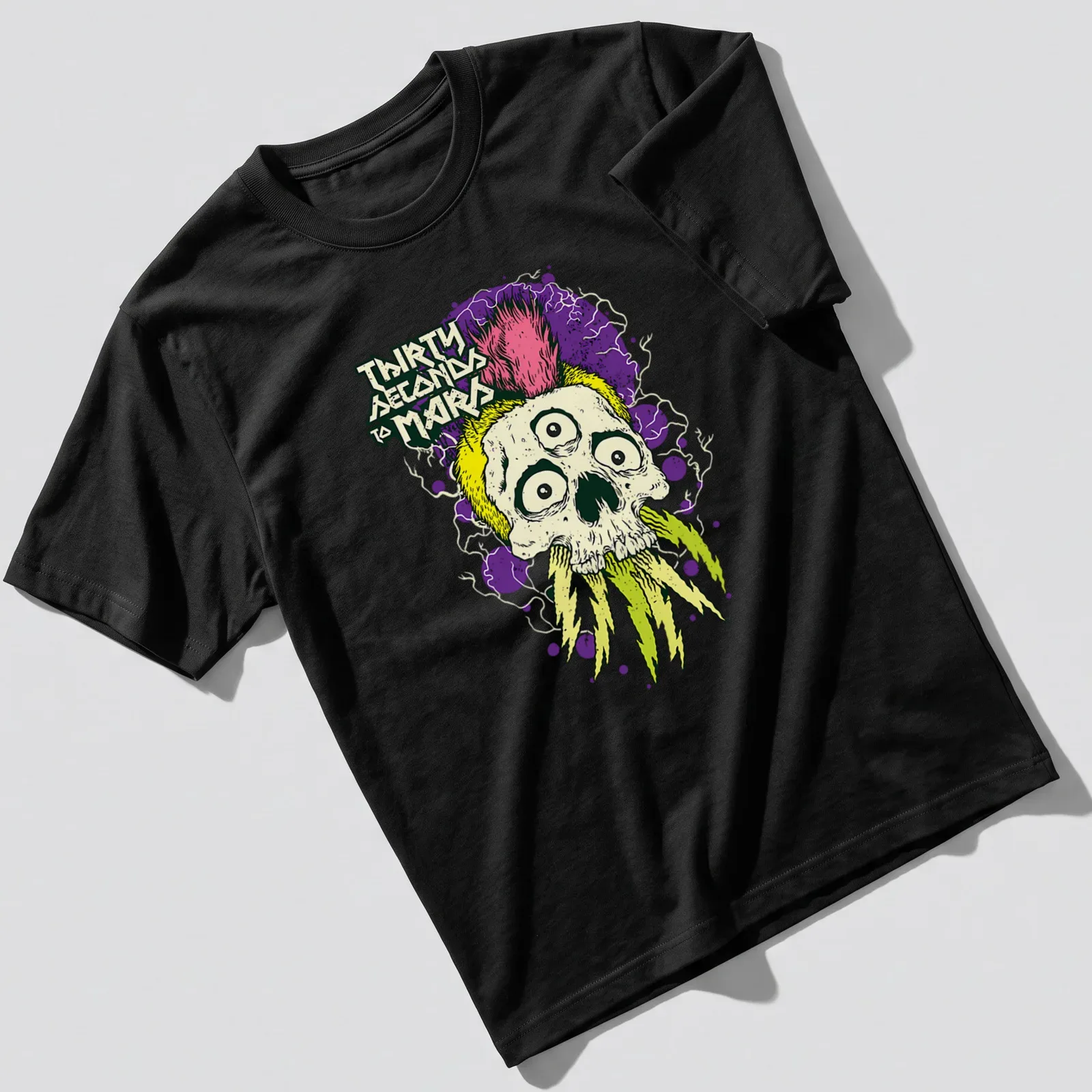Vibrant illustration of a mohawk skull with the text Thirty Seconds To Mars — printed on a unisex t-shirt