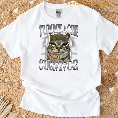 Cartoon cat in helmet with text TUMMY ACHE SURVIVOR underneath