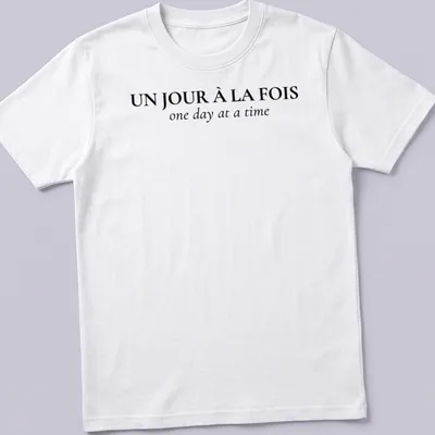 Typographic design with French and English text: Un Jour À La FOIS one day at a time