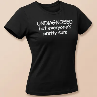 Funny t-shirt with text 'UNDIAGNOSED but everyone's pretty sure' — printed on a women's shirt