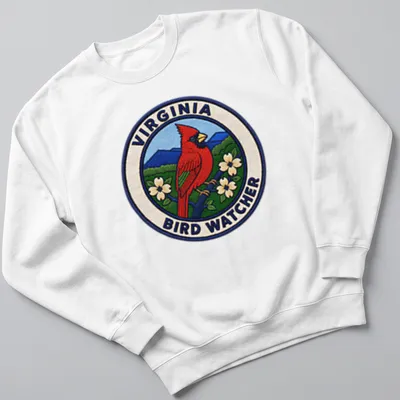 Vintage patch design featuring a Northern Cardinal on a birdwatching — printed on a unisex sweatshirt