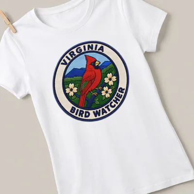 Vintage patch design featuring a Northern Cardinal on a birdwatching — printed on a women's shirt