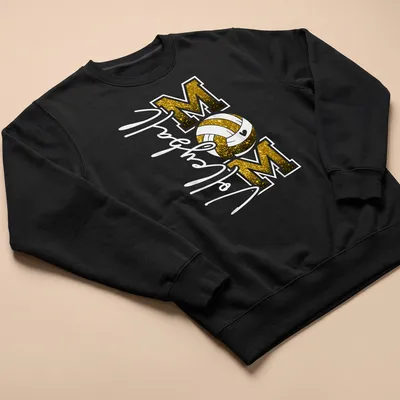 Volleyball Mom T-shirt with glittery black and gold text and a volleyball graphic. — printed on a unisex sweatshirt