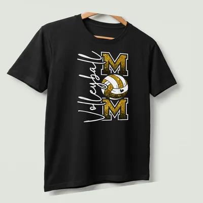 Volleyball Mom T-shirt with glittery black and gold text and a volleyball graphic. — printed on a unisex t-shirt (angled view)