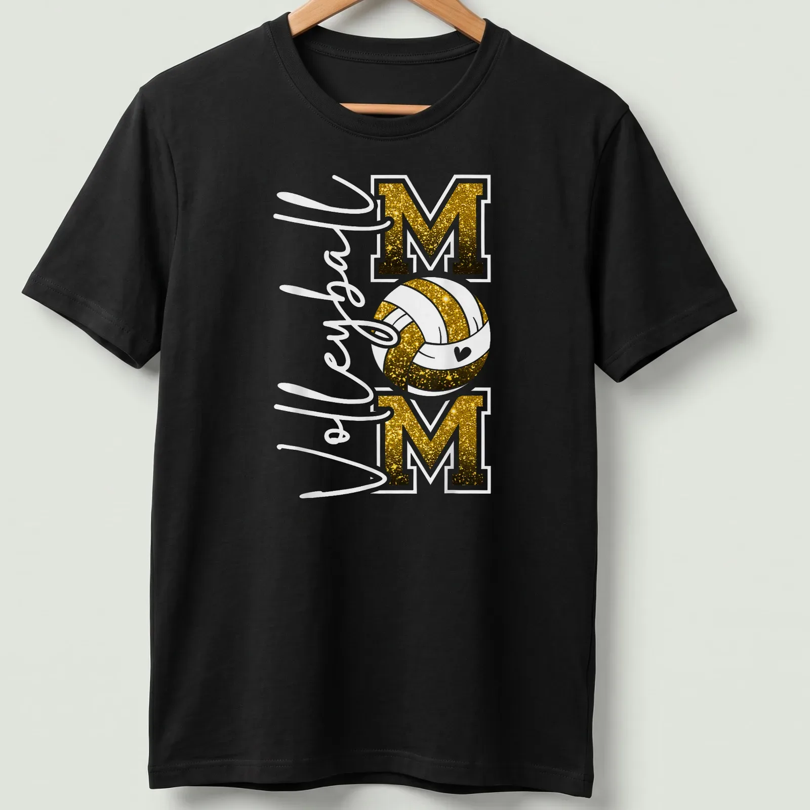 Volleyball Mom T-shirt with glittery black and gold text and a volleyball graphic. — printed on a unisex t-shirt