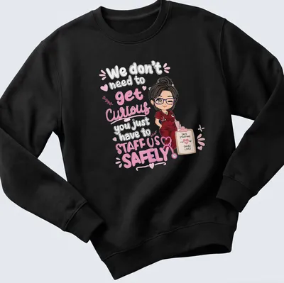 Kawaii illustration of a female nurse with text about staffing safety. — printed on a unisex sweatshirt