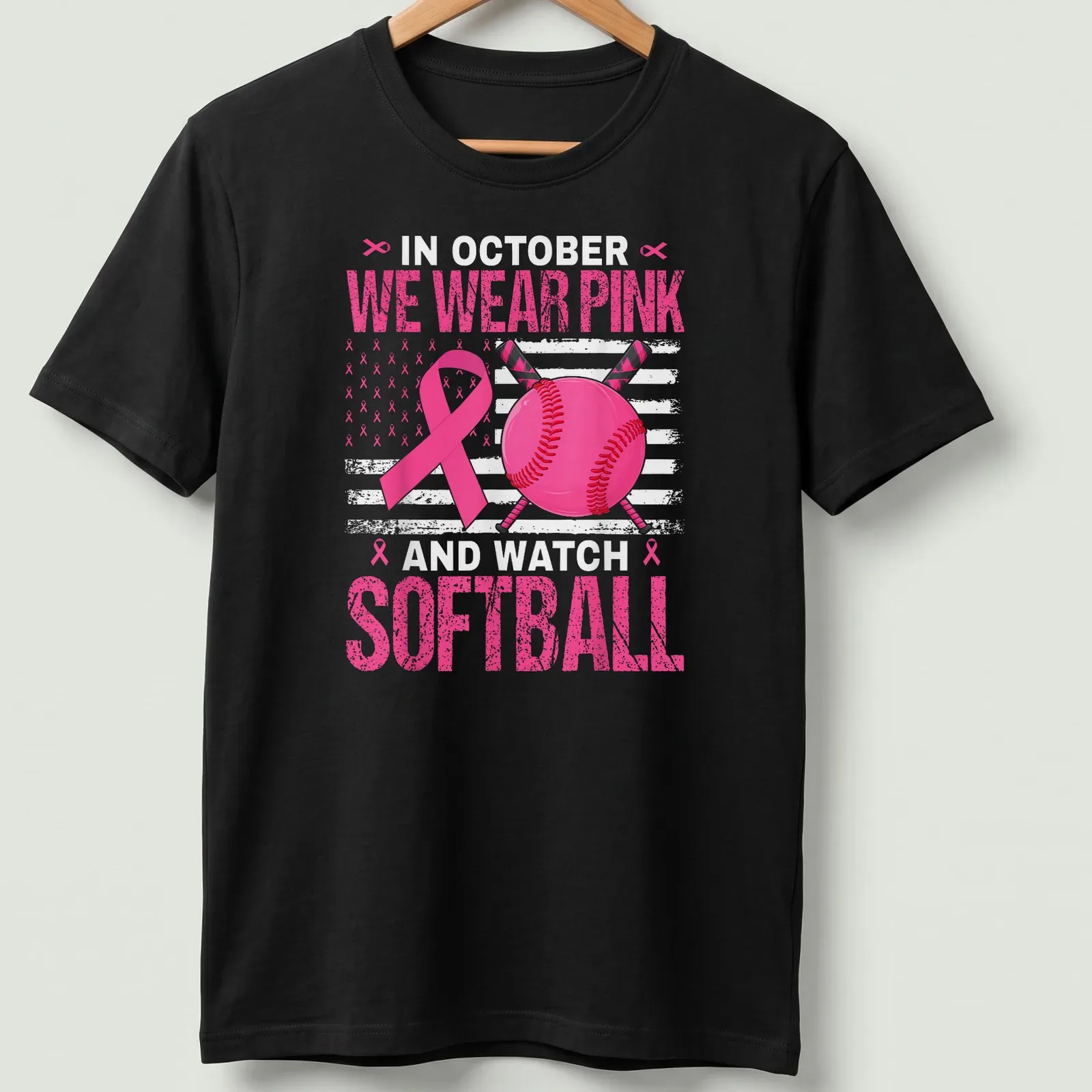 Bold graphic tee featuring pink ribbon and softball design — printed on a unisex t-shirt
