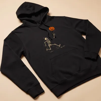 Playful line-art of a skeleton running with a pumpkin and humorous text above — printed on a unisex hoodie