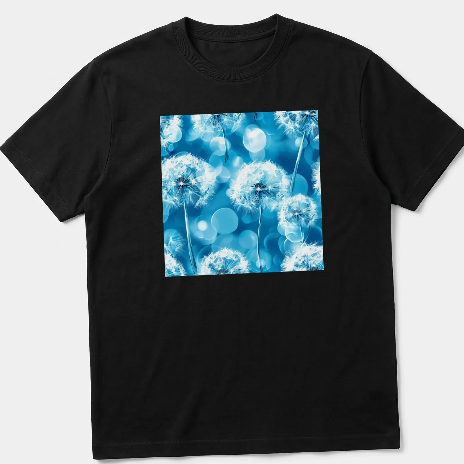 Boho-style T-shirt with white dandelion flowers on aqua blue background — printed on a unisex t-shirt